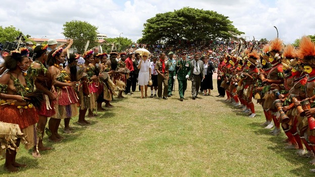 The Prince of Wales and Duchess of Cornwall meet dancers dressed in traditional dress