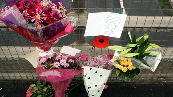 Flowers and tributes left on a bridge overlooking the M5 at Taunton, Somerset.