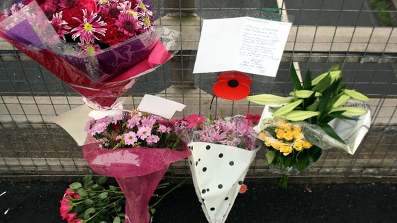 Flowers and tributes left on a bridge overlooking the M5 at Taunton, Somerset. Seven people were killed in the crash exactly one year ago.