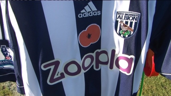 The poppy-themed shirts will be auctioned to raise money for the Royal British Legion