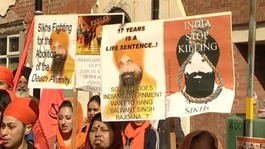 People holding banners at today's protest in Birmingham