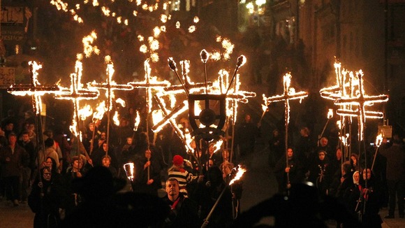 Residents of Lewes walk through the town centre