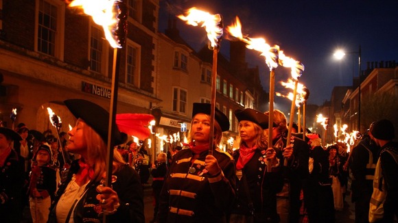 Women dressed as soldiers march in Lewes
