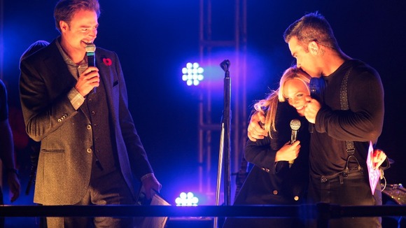 Robbie Williams joined on stage by Emma Bunton and Jamie Theakston