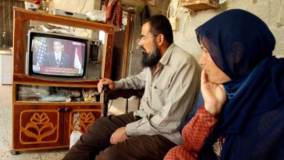 Palestinians watch speech by US President Barack Obama at their house in the southern Gaza Strip in 2009.