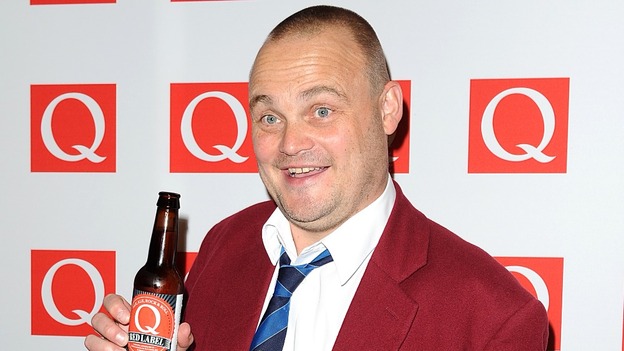Al Murray posing at the Q Awards