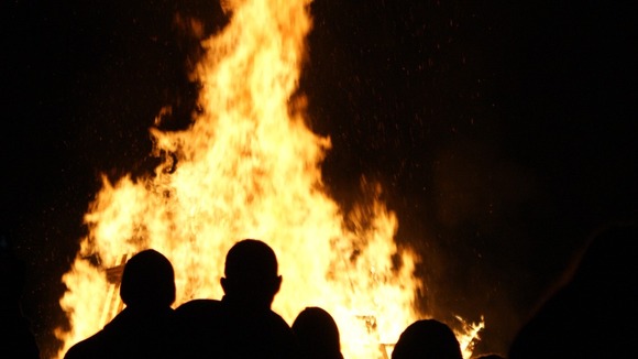 Families gather around the bonfire at Walker Park, Newcastle