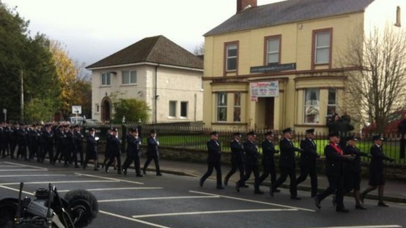 Officers from the Northern Ireland Prison Service provide a guard of honour