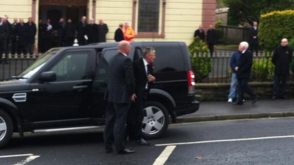 First Minister Peter Robinson arriving for the funeral
