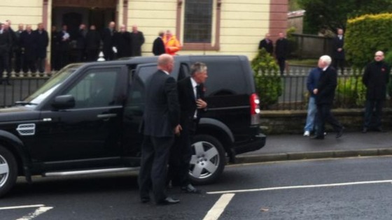 First Minister Peter Robinson arriving for the funeral