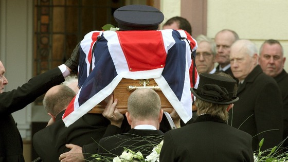  Prison officers carry the coffin to Molesworth Presbyterian Church of murdered colleague David Black