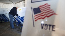 A man votes in a polling site built to service residents of the Queens borough neighborhoods of Breezy Point