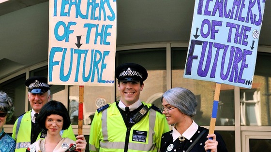 Students join their teachers demonstrating outside the Department of Education.