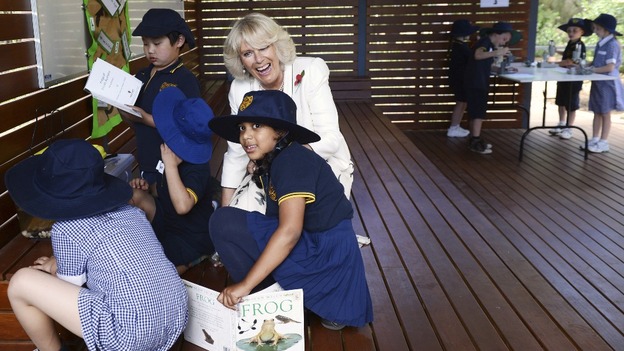 Camilla, Duchess of Cornwall, speaks to children looking after tadpoles at an Adelaide school