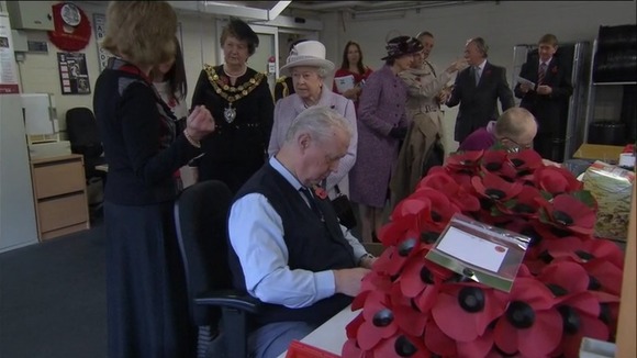 Queen visits poppy factory in Surrey.
