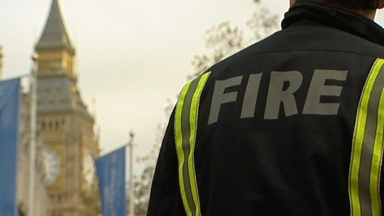 A firefighter in the shadow of Big Ben lobbying against cuts to the fire service