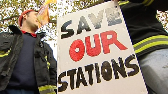 Placards against the closure of fire stations which union members say will happen if the service is cut further