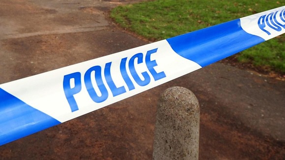 Police tape at the scene of a crime