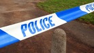 Police tape at the scene of a crime