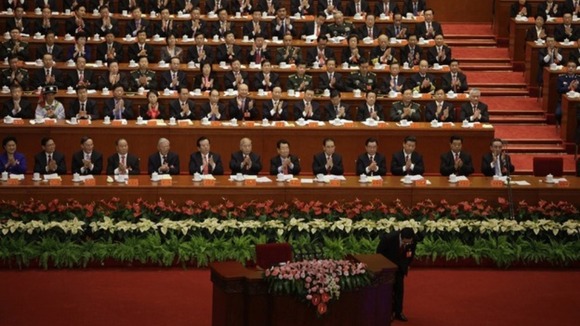 Delegates applaud as China's President Hu bows after a speech at the opening ceremony of 18th National Congress of Communist Party of China.