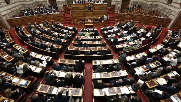 Greece's Prime Minister Antonis Samaras addresses parliamentarians before the austerity vote.