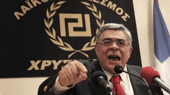 Nikolaos Michaloliakos, leader of the Golden Dawn party speaks during a news conference