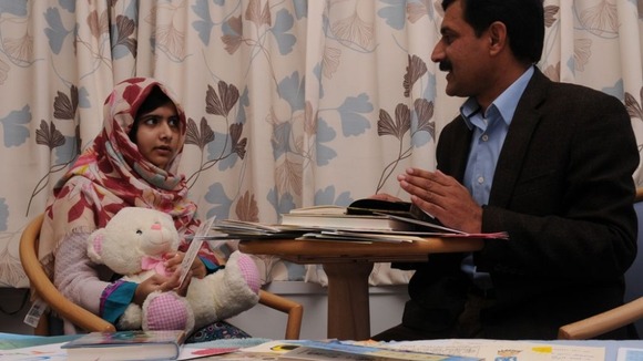 Ziauddin talks to his daughter at the hospital.