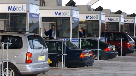 Vehicles approach Britain's first motorway toll on the M6 in Staffordshire.