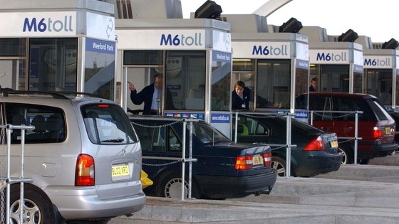 Vehicles approach Britain's first motorway toll on the M6 in Staffordshire.