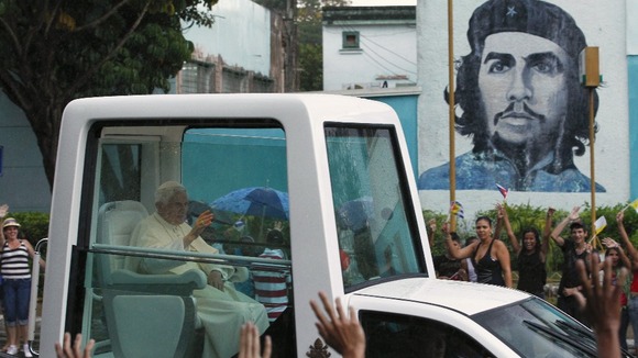 Pope Benedict XVI waves as he rides the popemobile on his way to the airport in Havana