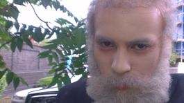Miles Alura, 16, wearing facial prosthetics, make-up and hair pieces to disguise himself as an old man.