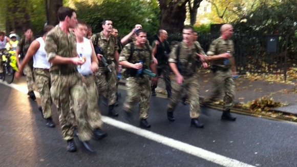 Royal Marines during their marathon speed-march in London today.