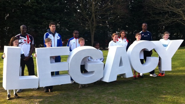 Children and athletes spelling out the word 'legacy'