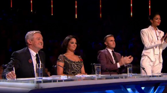 X Factor judges' applaud Jahmene Douglas's performance.