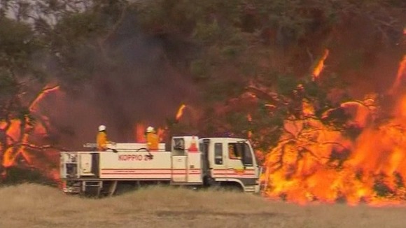Firefighters trying to contain the blaze