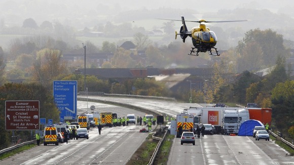 Emergency services at the scene on the M5 motorway close to Taunton in Somerset in November 2011