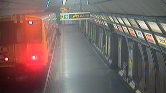 Georgia can be seen leaning against the train as it pulled out of the station