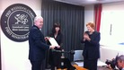First Minister Carwyn Jones hands the sealed Welsh Act to National Assembly Clerk Claire Clancy
