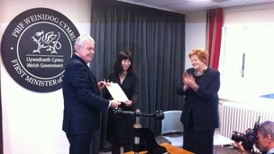 First Minister Carwyn Jones hands the sealed Welsh Act to National Assembly Clerk Claire Clancy