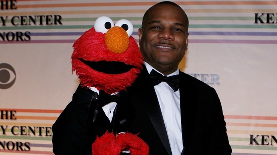 Elmo and Kevin Clash pose for photographers on the red carpet at the Kennedy Center in Washington