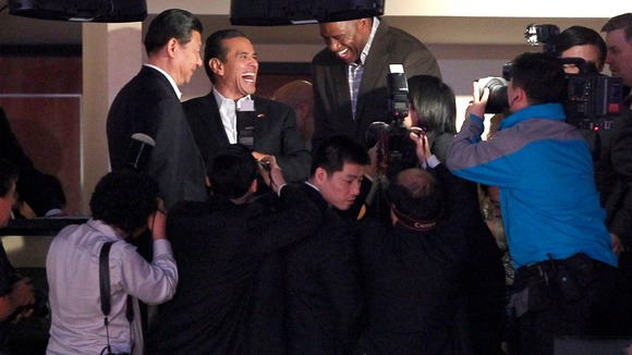 Xi Jinping meets Magic Johnson at a NBA basketball game in Los Angeles in February 2012