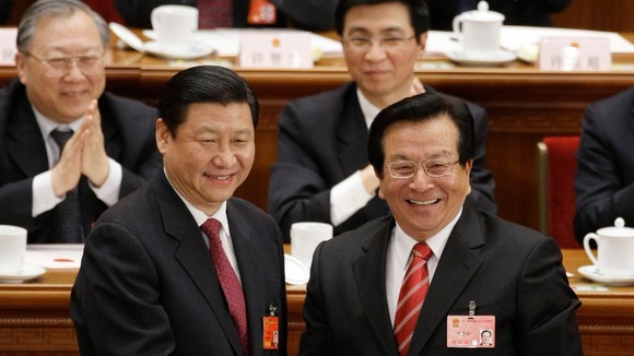 Newly elected Vice-President Xi shakes hands with his predecessor Zeng Qinghong in 2008.