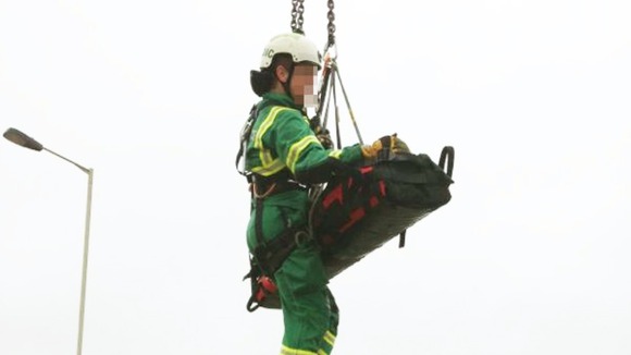 The man is winched with a member of the West Midlands Ambulance Service