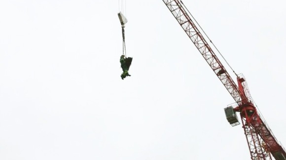 The man is winched with a member of the West Midlands Ambulance Service