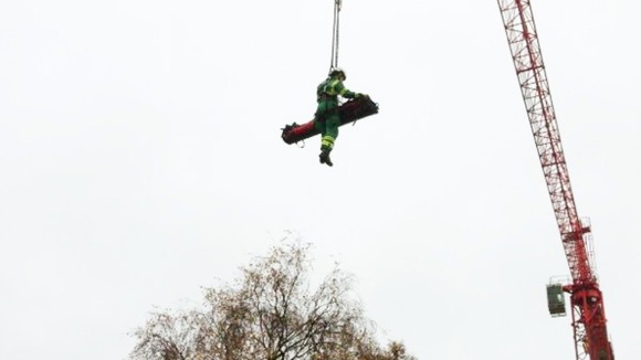 The man is winched with a member of the West Midlands Ambulance Service