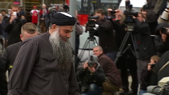 Abu Qatada arrives back in north London.