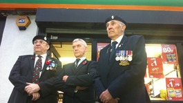 Jack Colbert from the Royal British Legion, shop owner Jeff Cheetham and standard bearer Ian Mackie outside the shop
