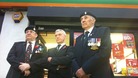 Jack Colbert from the Royal British Legion, shop owner Jeff Cheetham and standard bearer Ian Mackie outside the shop