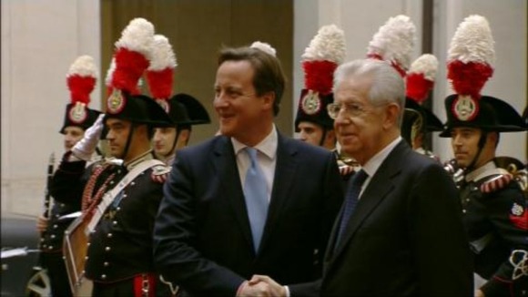 David Cameron is pictured shaking hands with his Italian counterpart Mario Monti.