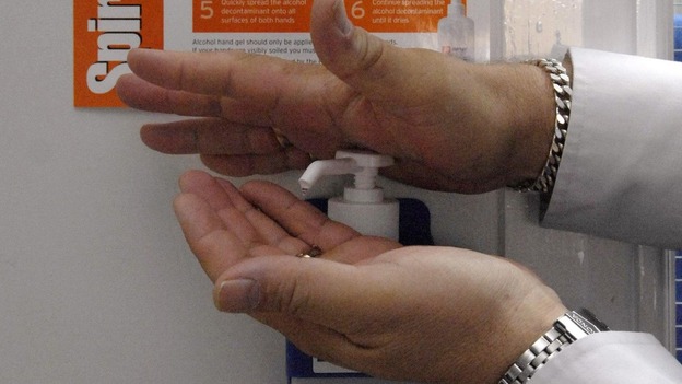 File photo: A person using an alcohol hand gel